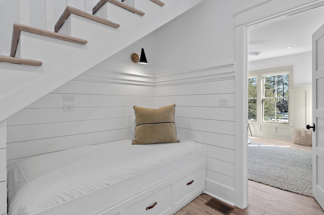 395 Tumblehome Way, Santa Rosa Beach, FL 32459 - mudroom featuring a decorative wall, light wood-style flooring, and a wainscoted wall