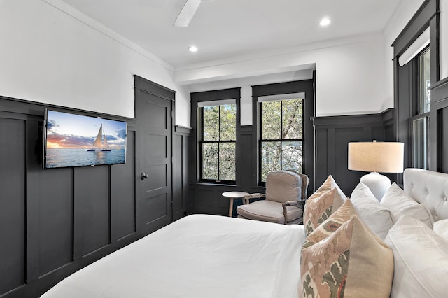 395 Tumblehome Way, Santa Rosa Beach, FL 32459 - bedroom featuring a decorative wall, ornamental molding, ceiling fan, wainscoting, and recessed lighting