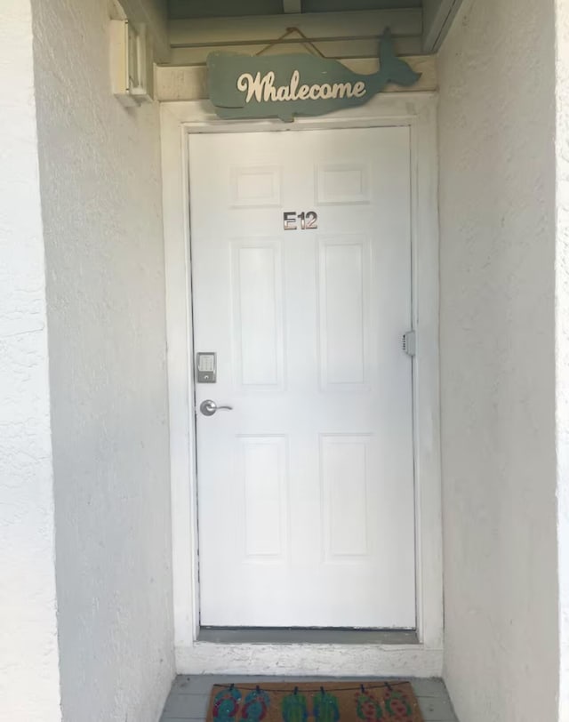 17614 Front Beach Rd Unit 12E, Panama City Beach, FL 32413 - property entrance with stucco siding