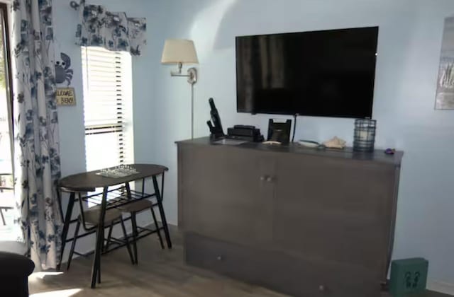 17614 Front Beach Rd Unit 12E, Panama City Beach, FL 32413 - living room featuring wood finished floors