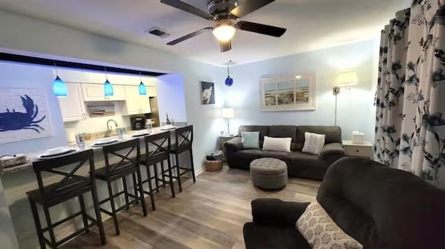 17614 Front Beach Rd Unit 12E, Panama City Beach, FL 32413 - living area with ceiling fan and wood finished floors