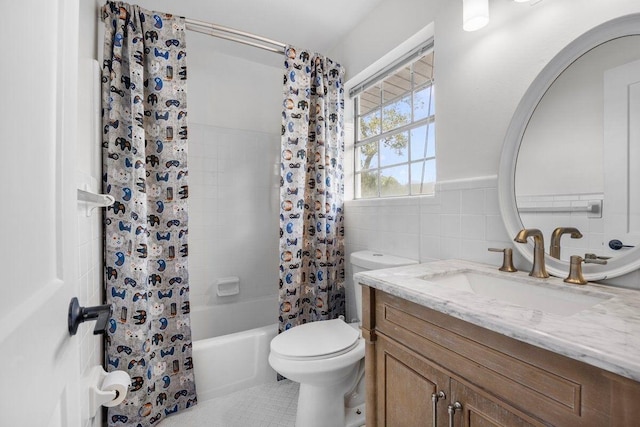 1011 Creel St, Fort Walton Beach, FL 32547 - full bath with vanity, shower / bath combo with shower curtain, tile walls, and wainscoting