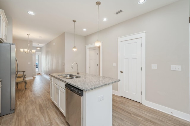400 Mattie M Kelly Blvd Unit 7, Destin, FL 32541 - kitchen with stainless steel appliances, light wood finished floors, white cabinets, and recessed lighting