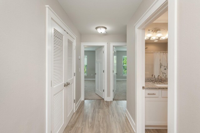 400 Mattie M Kelly Blvd Unit 7, Destin, FL 32541 - hall featuring baseboards and light wood-type flooring