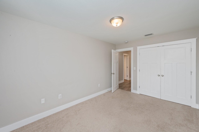 400 Mattie M Kelly Blvd Unit 7, Destin, FL 32541 - unfurnished bedroom featuring carpet flooring and a closet