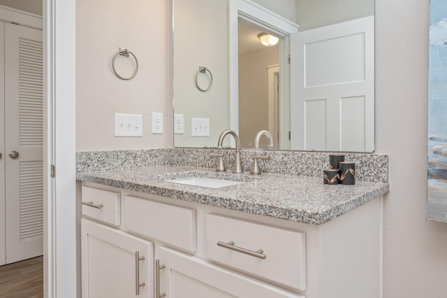 400 Mattie M Kelly Blvd Unit 7, Destin, FL 32541 - bathroom featuring vanity, wood finished floors, and a closet
