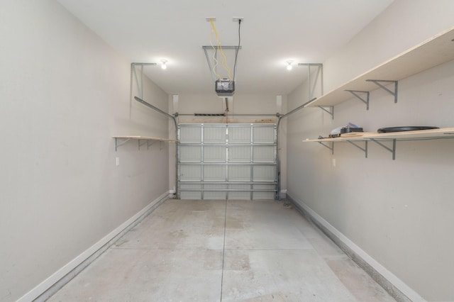 400 Mattie M Kelly Blvd Unit 7, Destin, FL 32541 - garage featuring a garage door opener and baseboards