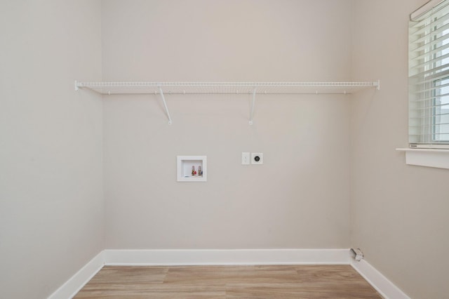 400 Mattie M Kelly Blvd Unit 7, Destin, FL 32541 - washroom featuring electric dryer hookup, washer hookup, and light wood-style flooring