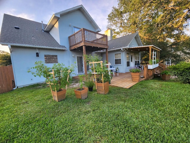 2969 Laurel Dr, Gulf Breeze, FL 32563 - back of property featuring stucco siding, a balcony, a shingled roof, and a deck