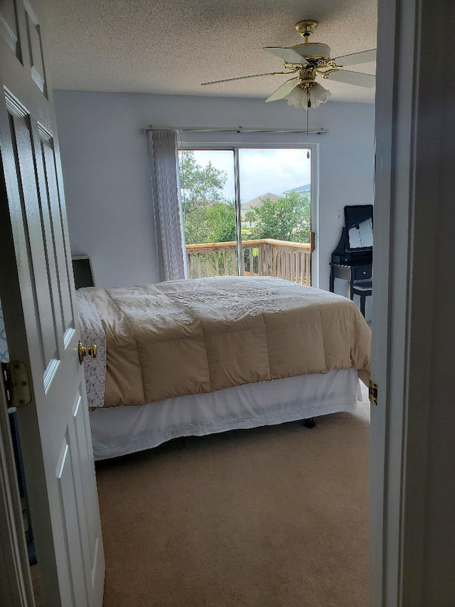 2969 Laurel Dr, Gulf Breeze, FL 32563 - carpeted bedroom with a ceiling fan and a textured ceiling