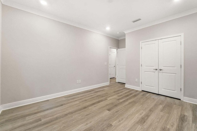 54 Kara Lake Dr, Santa Rosa Beach, FL 32459 - unfurnished bedroom with light wood finished floors, crown molding, recessed lighting, and a closet