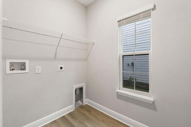 54 Kara Lake Dr, Santa Rosa Beach, FL 32459 - laundry area with hookup for an electric dryer, washer hookup, and wood finished floors