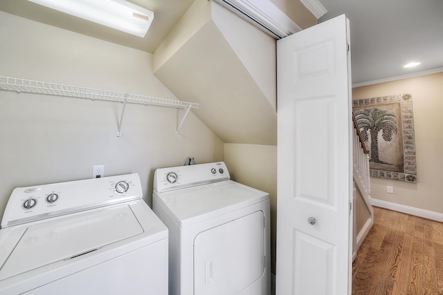 2905 Scenic Gulf Dr, Miramar Beach, FL 32550 - washroom with washing machine and clothes dryer, light wood-style flooring, and recessed lighting