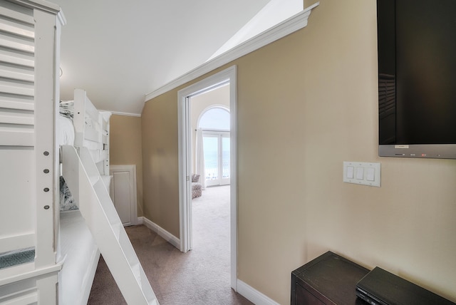 2905 Scenic Gulf Dr, Miramar Beach, FL 32550 - bedroom featuring light colored carpet, vaulted ceiling, and ornamental molding