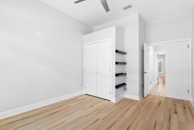 2050 Biscayne Blvd, Navarre, FL 32566 - unfurnished bedroom featuring light wood-type flooring, a closet, and ceiling fan