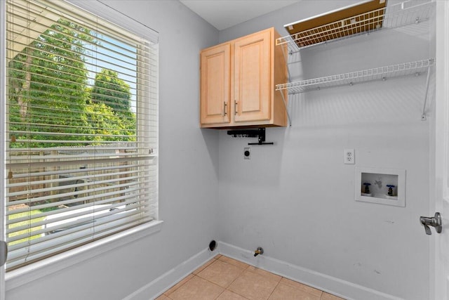 2050 Biscayne Blvd, Navarre, FL 32566 - laundry room with electric dryer hookup, hookup for a washing machine, cabinet space, light tile patterned floors, and gas dryer hookup