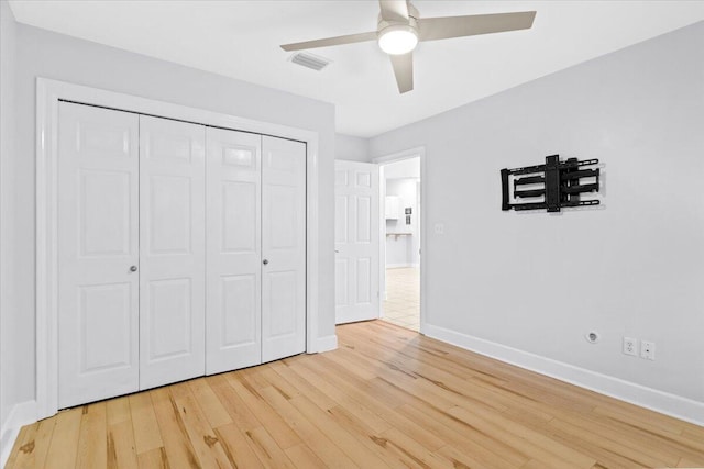2050 Biscayne Blvd, Navarre, FL 32566 - unfurnished bedroom featuring light wood-type flooring, a closet, and a ceiling fan