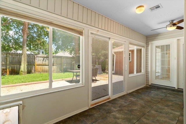 2050 Biscayne Blvd, Navarre, FL 32566 - unfurnished sunroom featuring ceiling fan and healthy amount of natural light