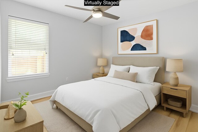 2050 Biscayne Blvd, Navarre, FL 32566 - bedroom featuring light wood-style flooring, multiple windows, and ceiling fan