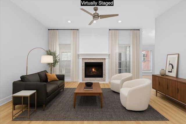 2050 Biscayne Blvd, Navarre, FL 32566 - living room with ceiling fan, wood finished floors, a tiled fireplace, and recessed lighting