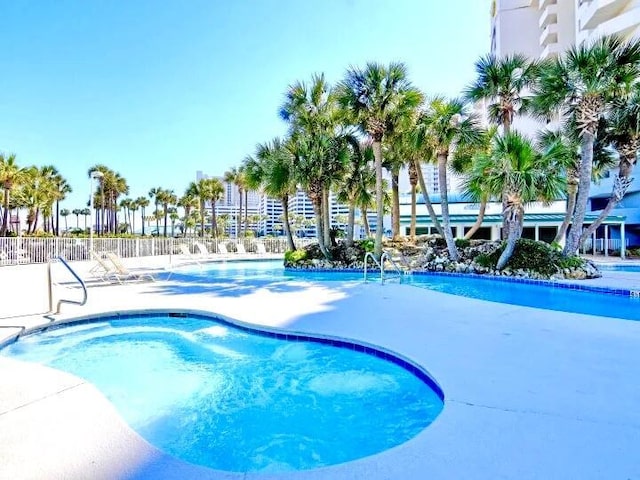 10517 Front Beach Rd Unit 1406, Panama City Beach, FL 32407 - community pool with a patio area