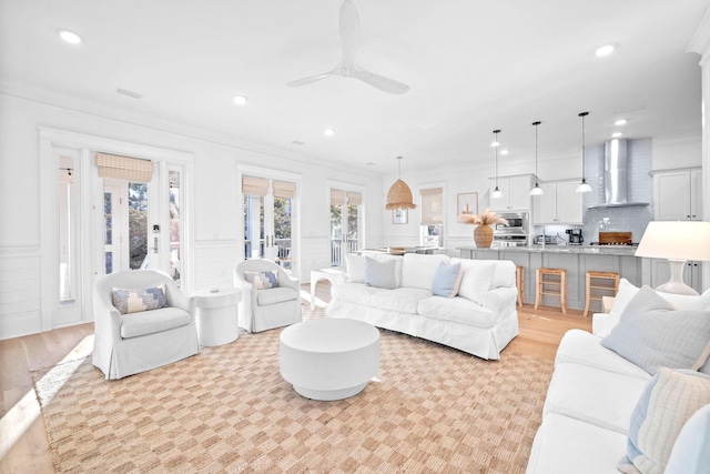 49 Clipper St, Inlet Beach, FL 32461 - living room featuring recessed lighting, ceiling fan, crown molding, light wood-style flooring, and wainscoting