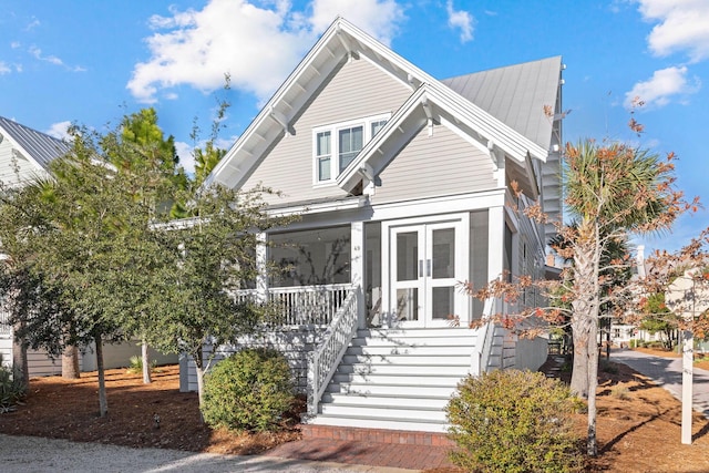 49 Clipper St, Inlet Beach, FL 32461 - view of front facade with a porch, stairway, and french doors
