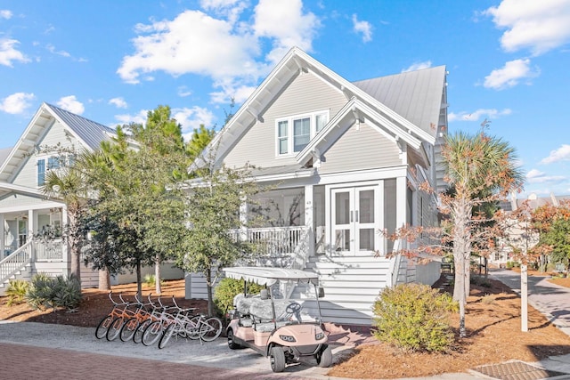 49 Clipper St, Inlet Beach, FL 32461 - view of front of house with stairway, covered porch, french doors, and a metal roof