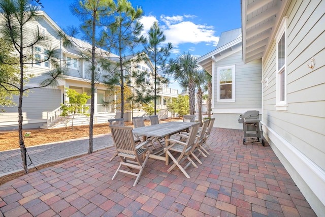 49 Clipper St, Inlet Beach, FL 32461 - view of patio with grilling area and outdoor dining area