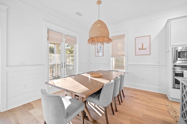49 Clipper St, Inlet Beach, FL 32461 - dining space featuring wainscoting, crown molding, french doors, and light wood-style flooring