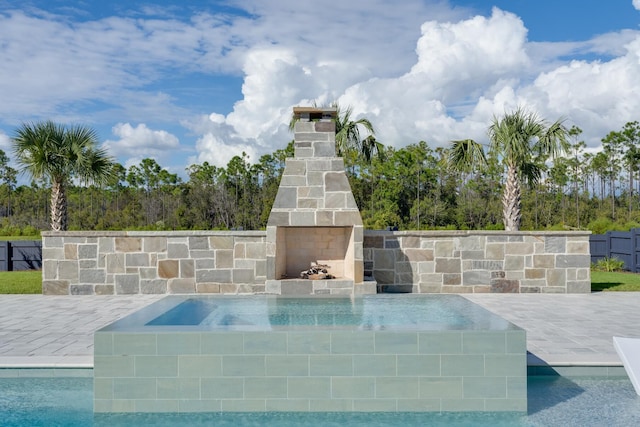 83 Norman Ct, Inlet Beach, FL 32461 - exterior view of an outdoor stone fireplace