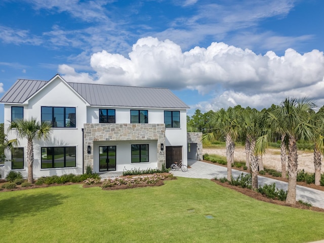 83 Norman Ct, Inlet Beach, FL 32461 - contemporary home with stucco siding, stone siding, driveway, and a front yard