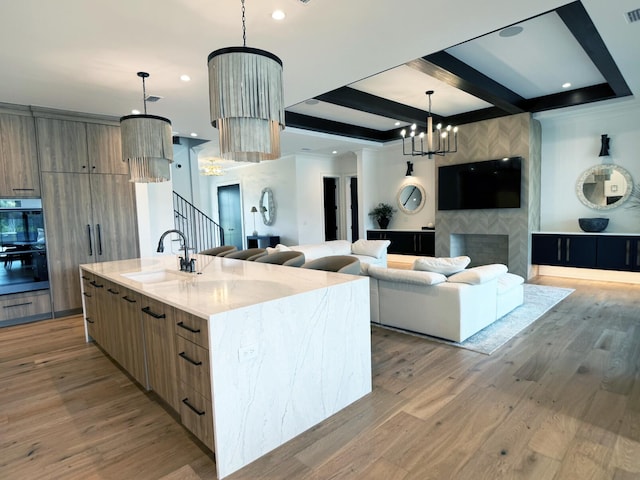 83 Norman Ct, Inlet Beach, FL 32461 - kitchen featuring modern cabinets, a chandelier, open floor plan, a large island, and beamed ceiling