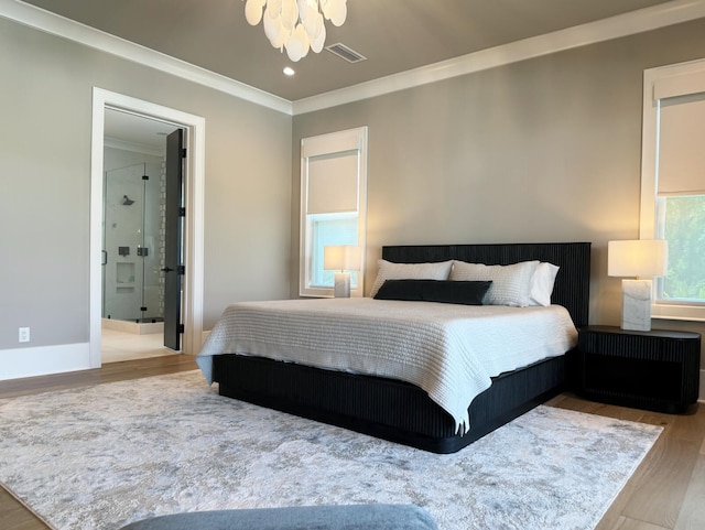 83 Norman Ct, Inlet Beach, FL 32461 - bedroom with crown molding, wood finished floors, ensuite bath, recessed lighting, and a chandelier