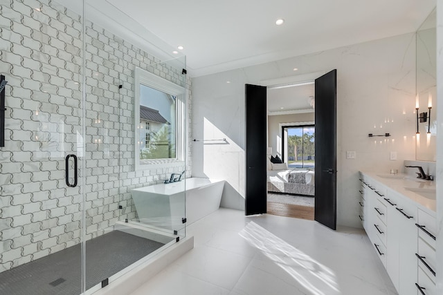 83 Norman Ct, Inlet Beach, FL 32461 - ensuite bathroom featuring a freestanding tub, a stall shower, double vanity, recessed lighting, and tile patterned floors