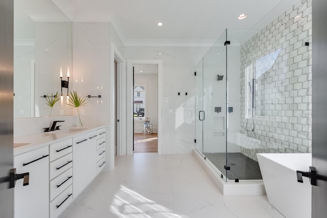 83 Norman Ct, Inlet Beach, FL 32461 - bathroom featuring double vanity, a freestanding tub, a shower stall, recessed lighting, and marble finish floors