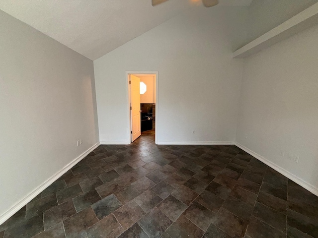 7167 Manatee St, Navarre, FL 32566 - spare room with ceiling fan, high vaulted ceiling, and dark stone finish flooring