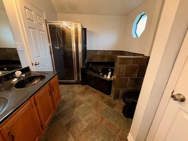 7167 Manatee St, Navarre, FL 32566 - bathroom with a shower stall, a bath, stone tile flooring, double vanity, and tile walls