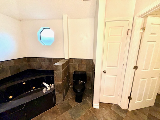 7167 Manatee St, Navarre, FL 32566 - bathroom with a whirlpool tub and tile walls