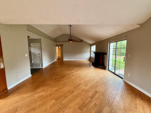 7167 Manatee St, Navarre, FL 32566 - unfurnished living room featuring lofted ceiling, light wood-style flooring, and a ceiling fan