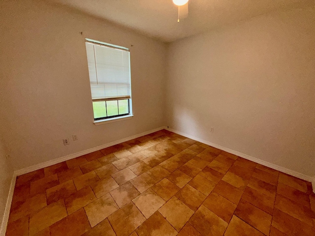 7167 Manatee St, Navarre, FL 32566 - spare room with baseboards and a ceiling fan