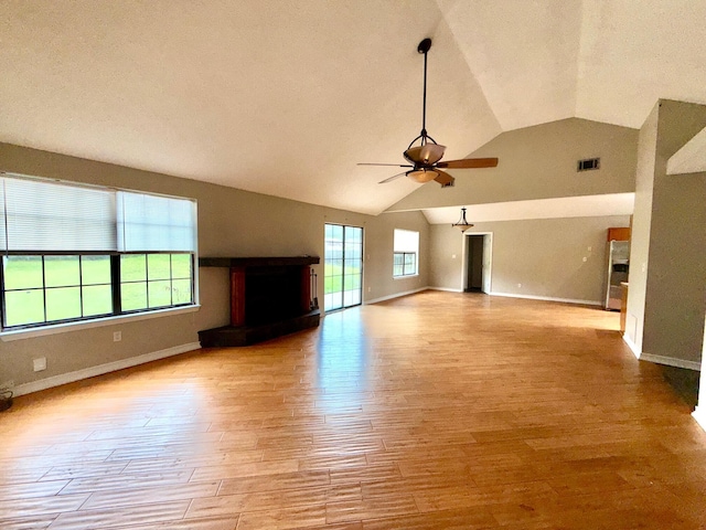 7167 Manatee St, Navarre, FL 32566 - unfurnished living room with lofted ceiling, ceiling fan, and wood finished floors