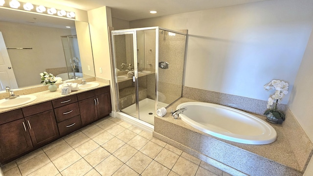 9902 S Thomas Dr Unit 933, Panama City Beach, FL 32408 - full bathroom with tile patterned flooring, a bath, double vanity, a shower stall, and recessed lighting