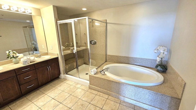9902 S Thomas Dr Unit 933, Panama City Beach, FL 32408 - bathroom with tile patterned floors, vanity, a bath, a stall shower, and recessed lighting