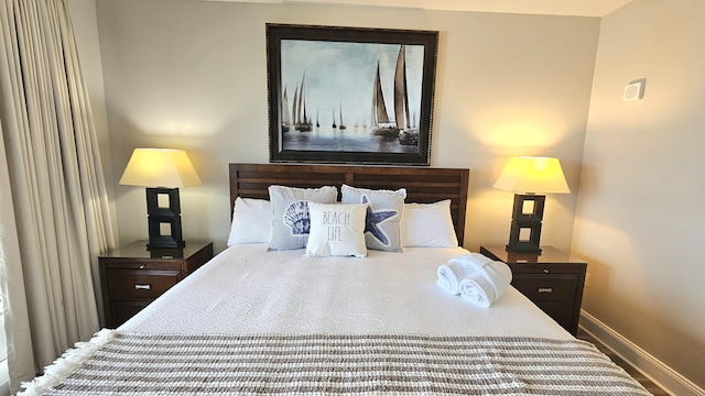 9902 S Thomas Dr Unit 933, Panama City Beach, FL 32408 - bedroom featuring baseboards