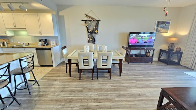 9902 S Thomas Dr Unit 933, Panama City Beach, FL 32408 - dining room with light wood-type flooring and baseboards