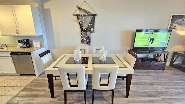 9902 S Thomas Dr Unit 933, Panama City Beach, FL 32408 - dining room with light wood-style floors