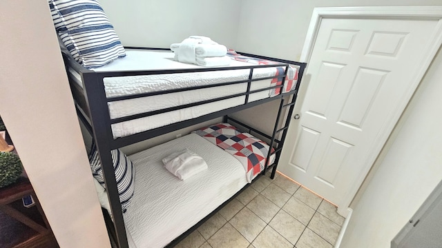 9902 S Thomas Dr Unit 933, Panama City Beach, FL 32408 - bedroom with light tile patterned floors