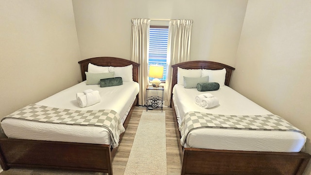 9902 S Thomas Dr Unit 933, Panama City Beach, FL 32408 - bedroom featuring wood finished floors