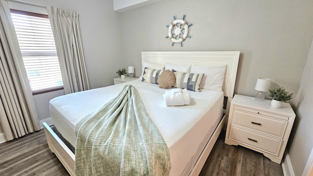 9902 S Thomas Dr Unit 933, Panama City Beach, FL 32408 - bedroom with dark wood finished floors